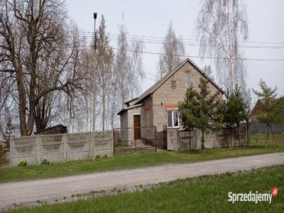 Dom z pomieszczeniem gospodarczym i działką