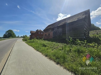 Atrakcyjna działka z domem i budynkami gospod.